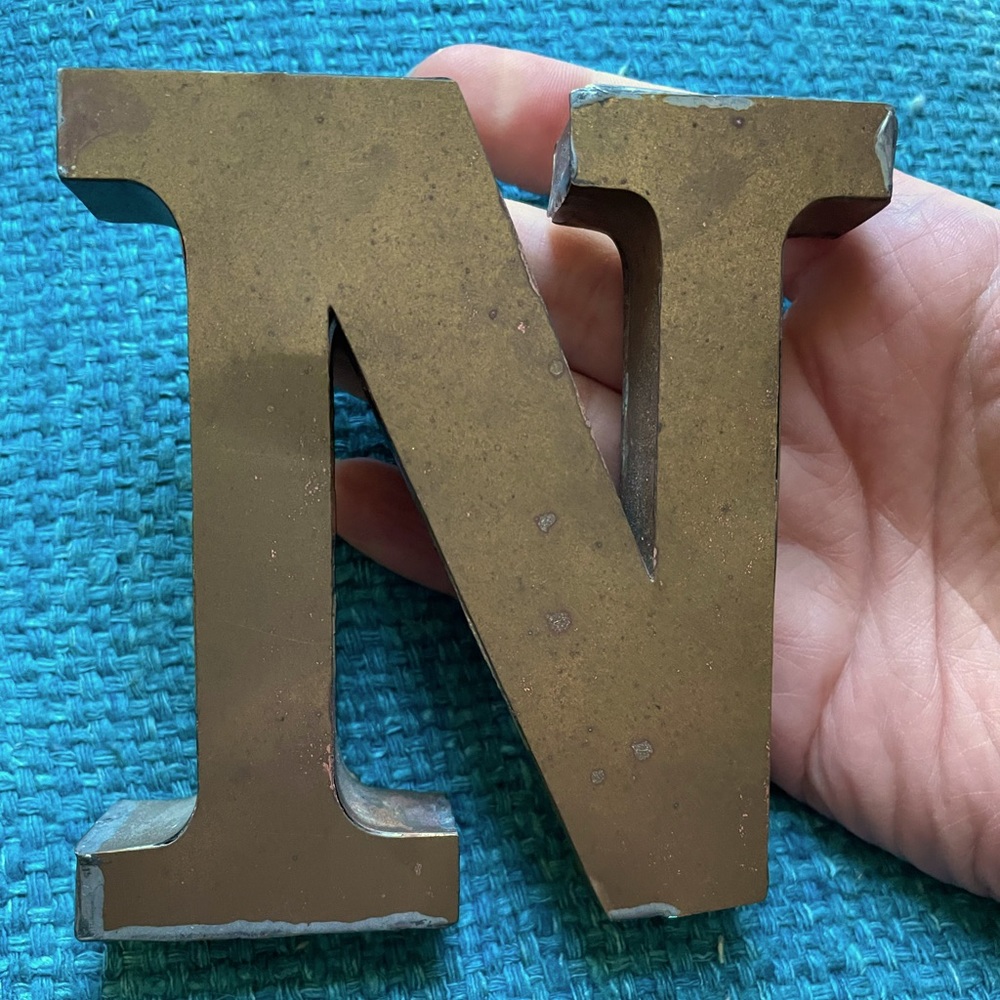 Brass initial “N” decor